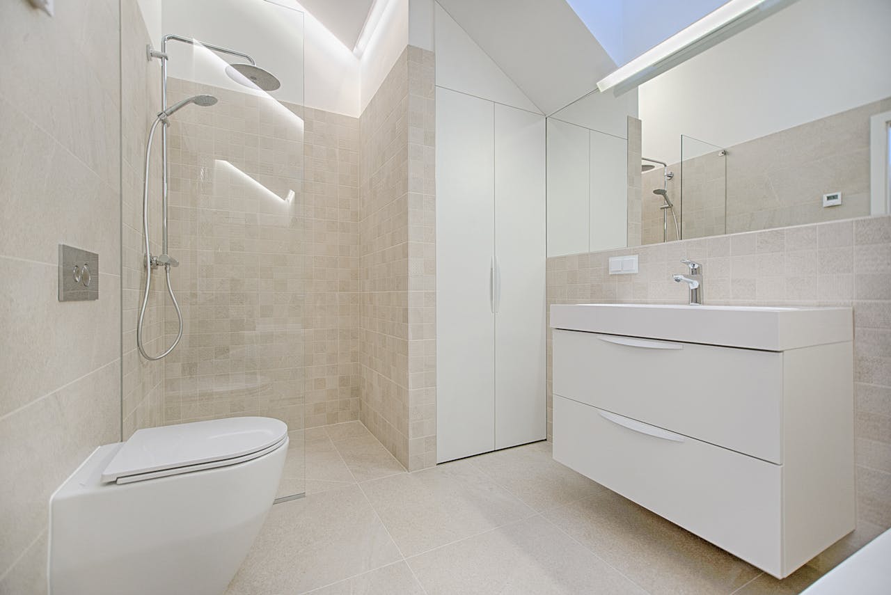 services-03 Bright and luxurious bathroom with contemporary fixtures and sleek design.